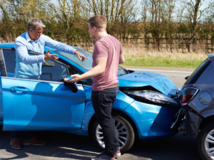 A rear end accident after the fact with two drivers talking next to it.