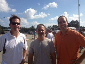 John Singleton and Ken Gibson visit with Gloucester Sheriff Darrell Warren at the Gloucester Deputies for Education Corn Hole Tournament.