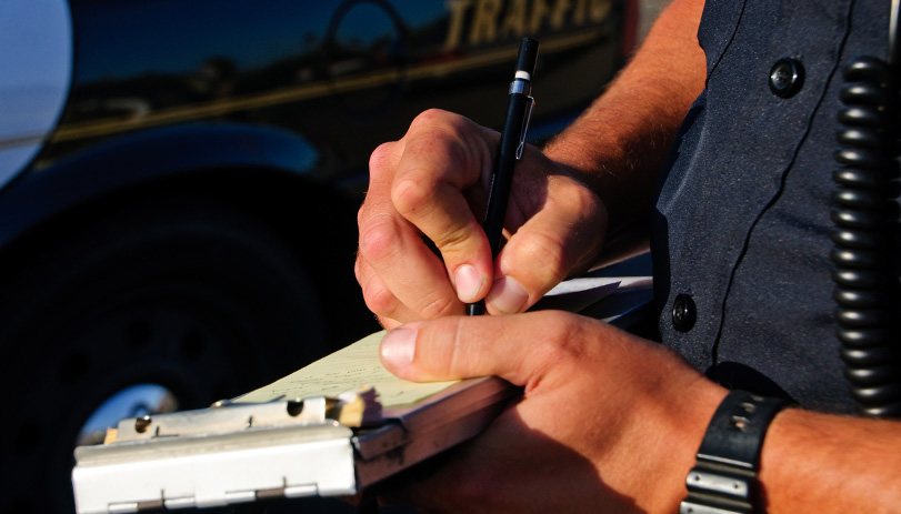 Police officer writing a ticket