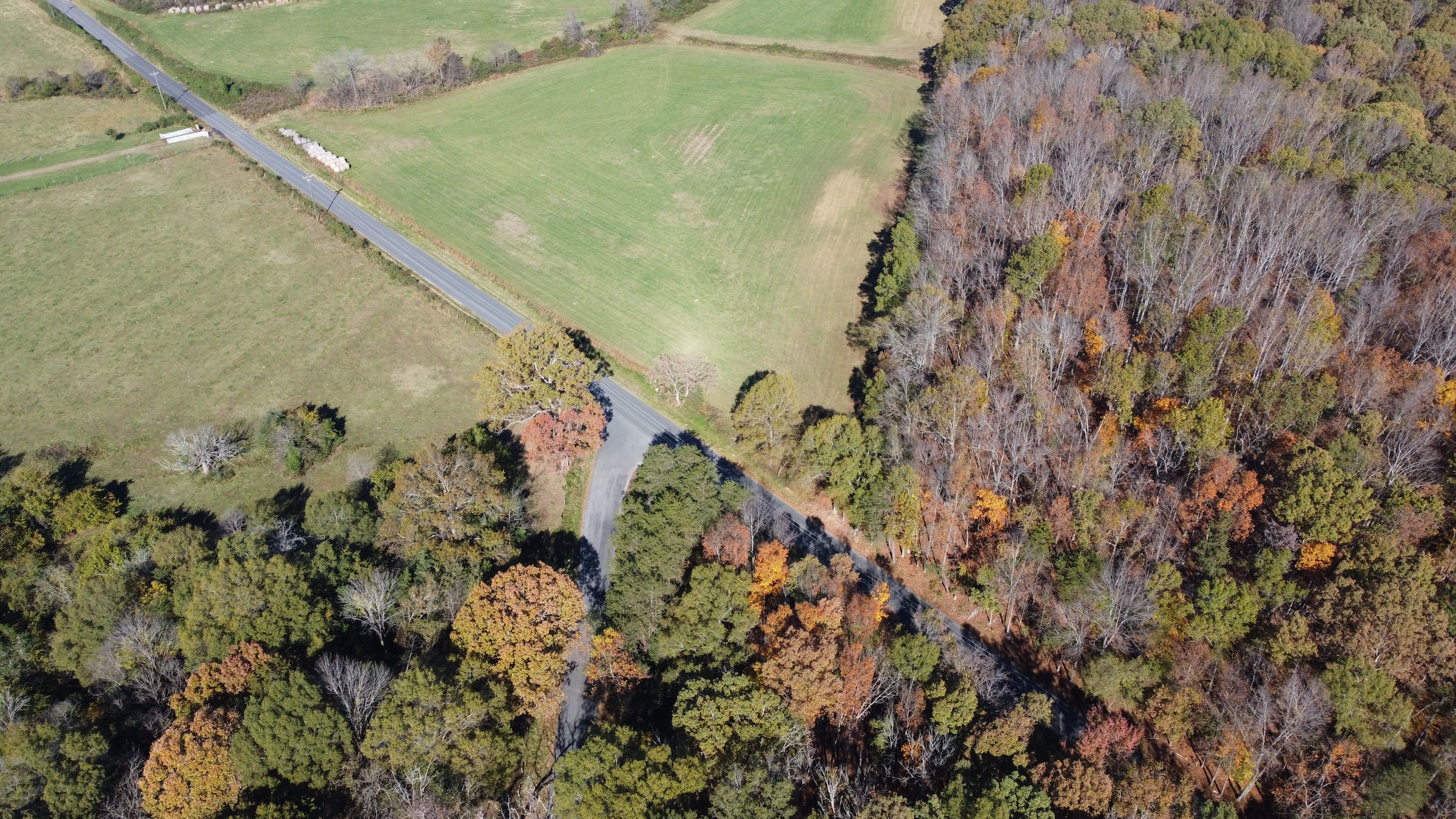 Birds eye view of a rural city with a large highway.